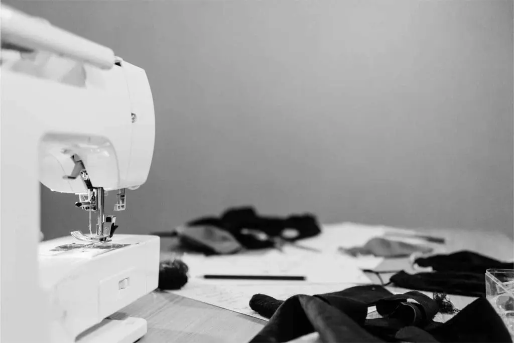 Black and White image of sewing machine and table