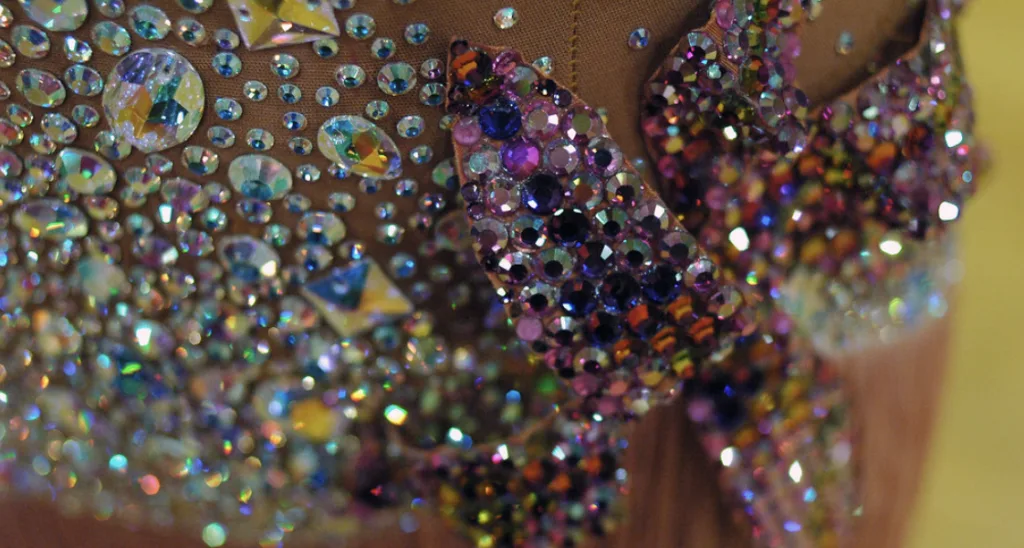 Rhinestones adding Sparkle to Cheer Uniforms and Dancewear